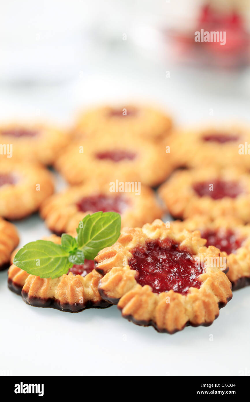 Chocolate dipped butter cookies with jelly center Stock Photo Alamy