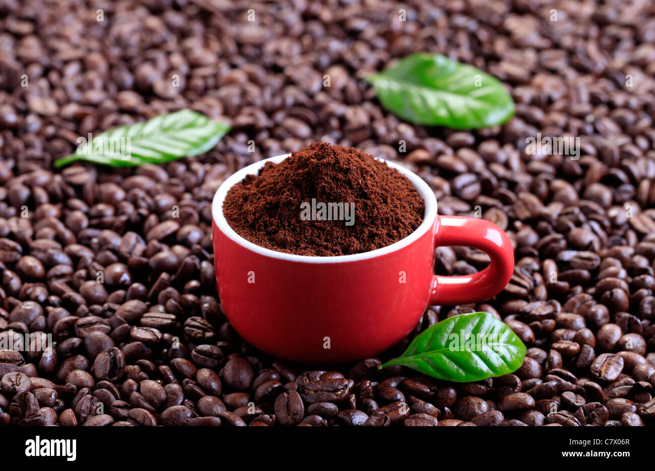 Freshly ground coffee in a red cup Stock Photo Alamy