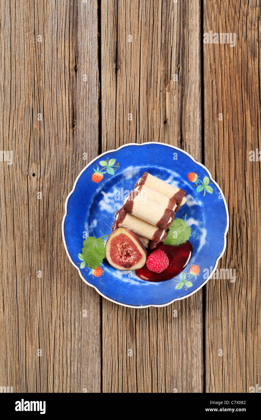 Tubeshaped pastry shells filled with a sweet creamy filling Stock