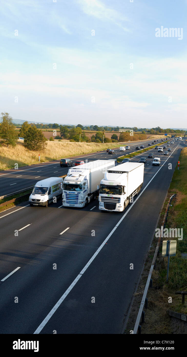 Overtaking lorries on the M6 motorway in Cheshire UK Stock Photo