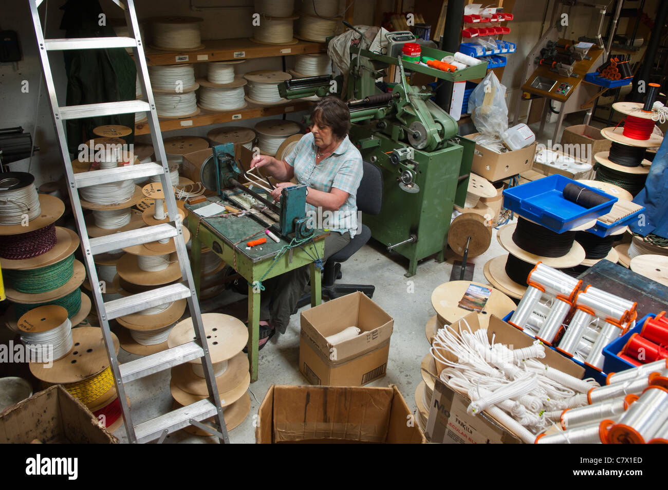 Ropemaker A woman making rope in the Ropemakers in Hawes in Wensleydale in North ...