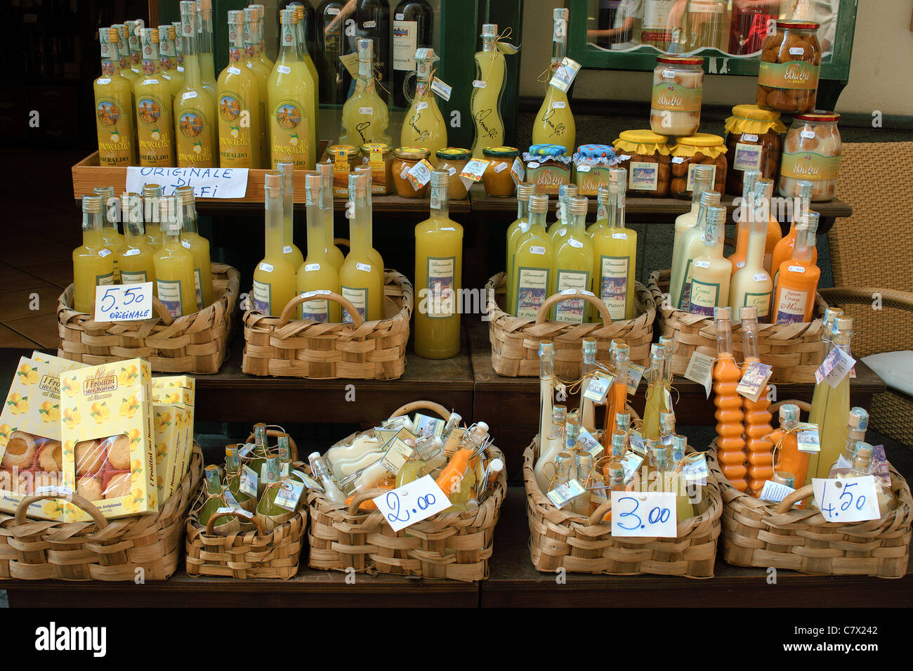 Limoncello liquor in souvenir bottles on display Amalfi Costiera