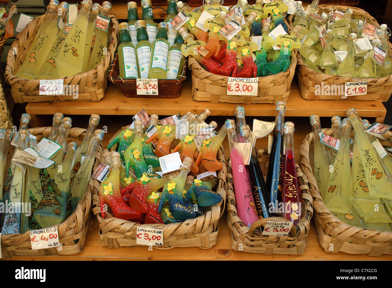 Limoncello liquor in souvenir bottles on display Amalfi Costiera