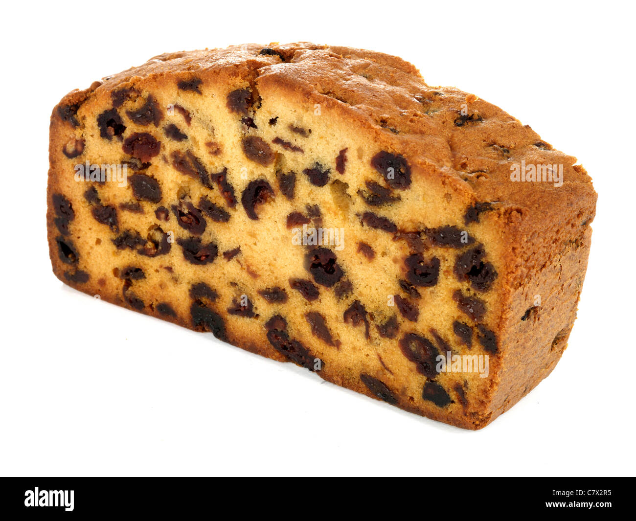 Fresh Rich Cranberry and Orange Fruit Cake Isolated Against A White Background With A Clipping Path And No People Stock Photo