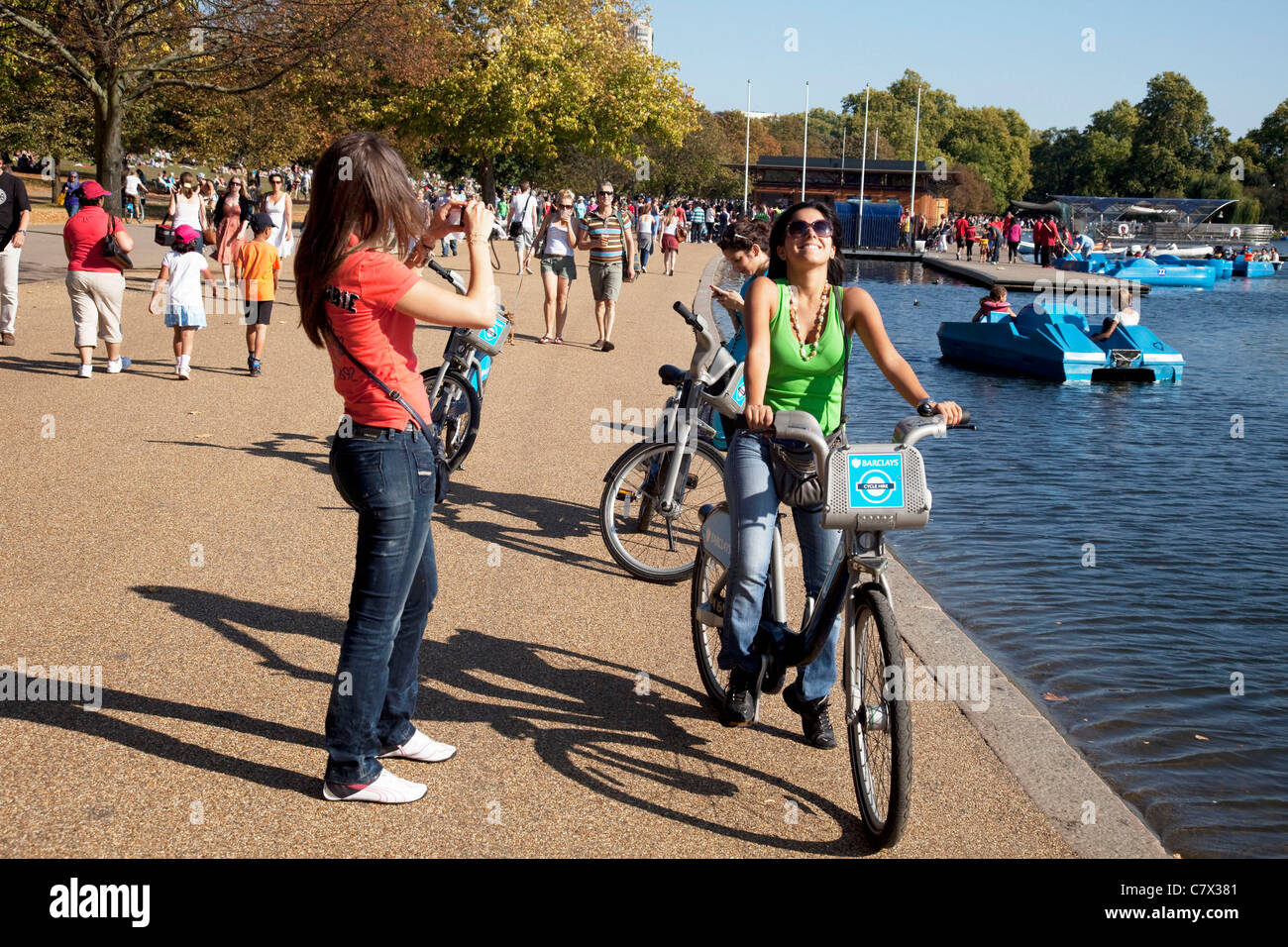 People out enjoying the hot weather beside The Serpentine in London