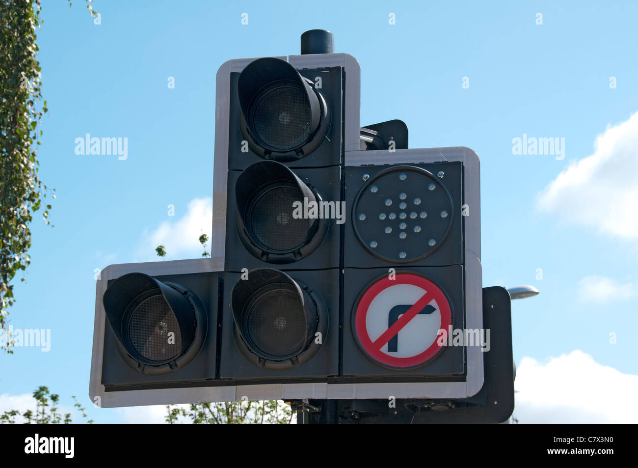 Traffic lights with tram direction indicator, East Manchester Line of the Metrolink tram system, Manchester, England, UK Stock Photo