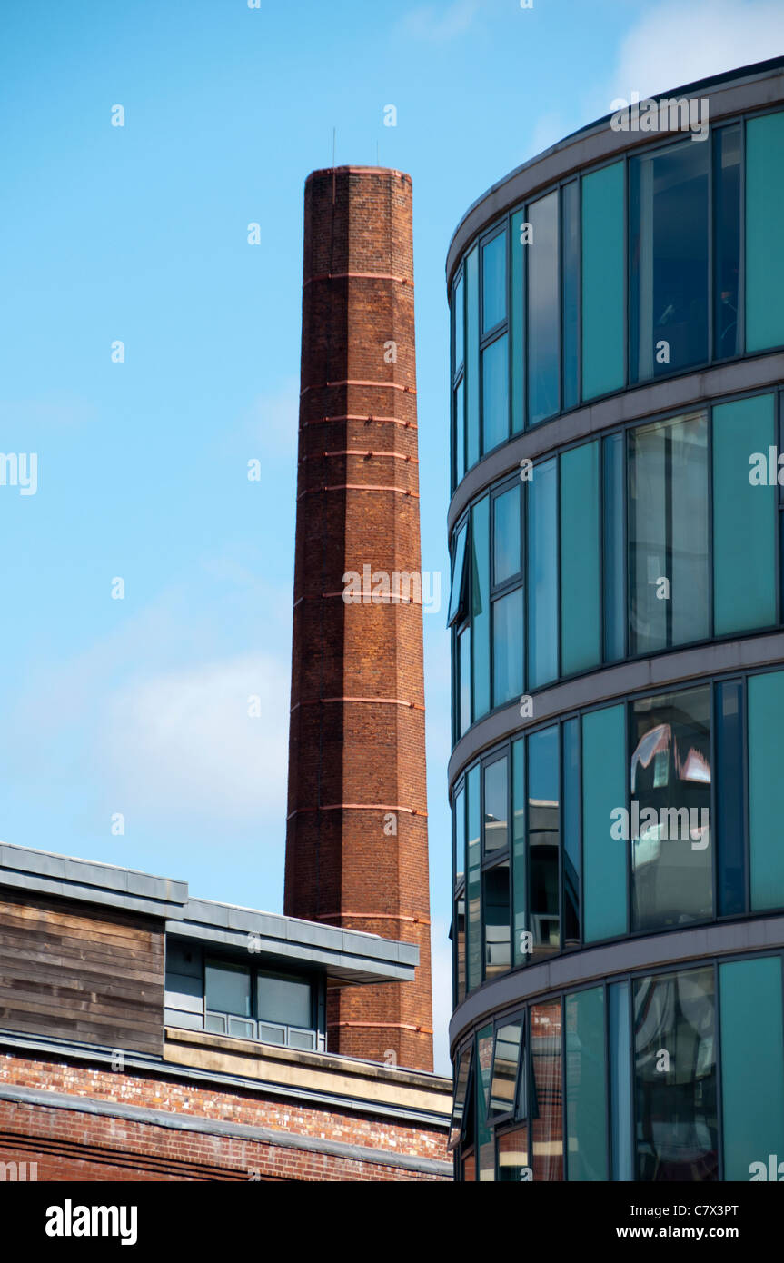 The Albion Works apartments and an old factory chimney, Pollard Street, Ancoats, Manchester, England, UK Stock Photo