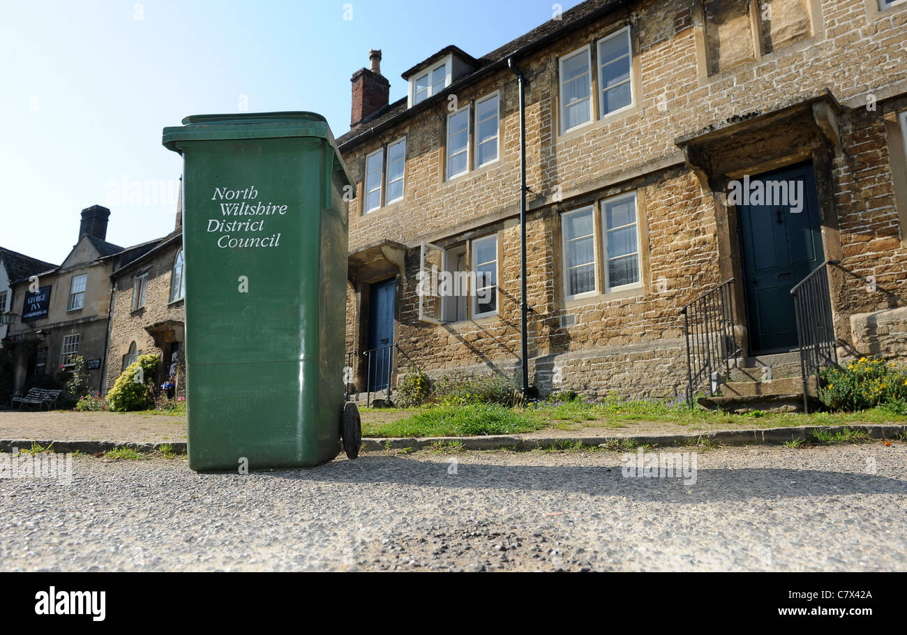 Green rubbish bin in village street Lacock Wiltshire Uk Stock Photo