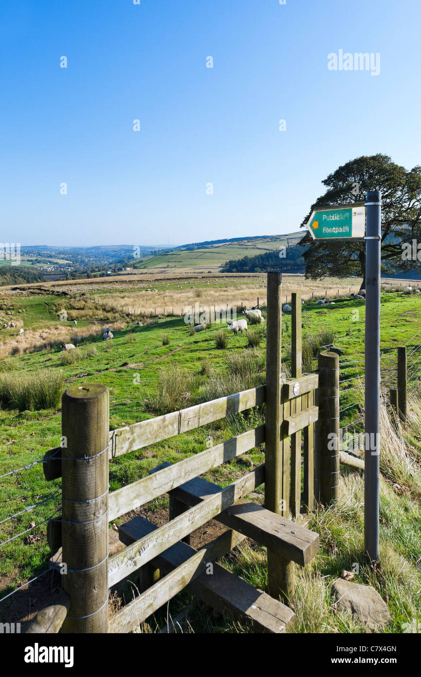 Stile over a public footpath above Holmfirth and the Holme Valley, Holme, West Yorkshire, England, United Kingdom Stock Photo