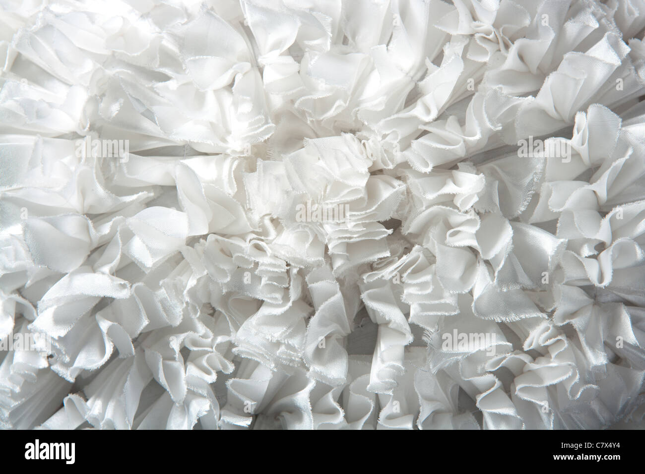 ruffled fabric pleated fashion texture background in white Stock Photo