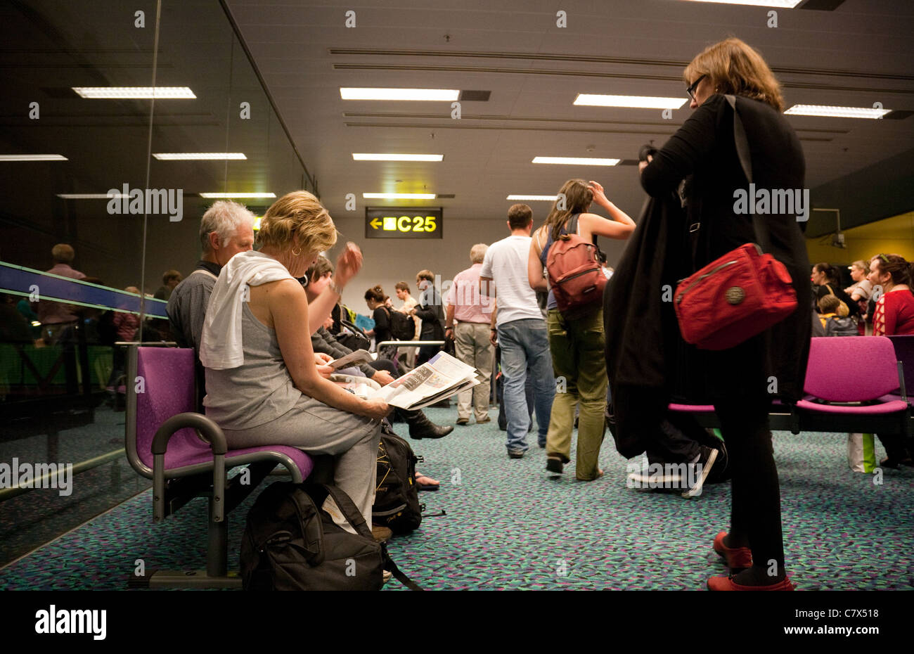 People queuing to board a plane at the gate, Changi airport Singapore Stock Photo