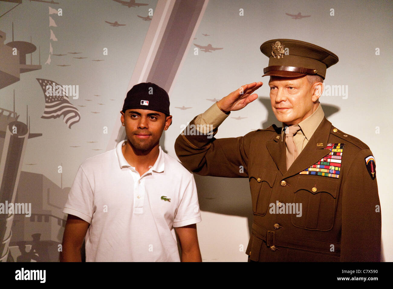 A Tourist posing with President Dwight D Eisenhower at Madame Tussauds waxworks, Washington DC USA Stock Photo