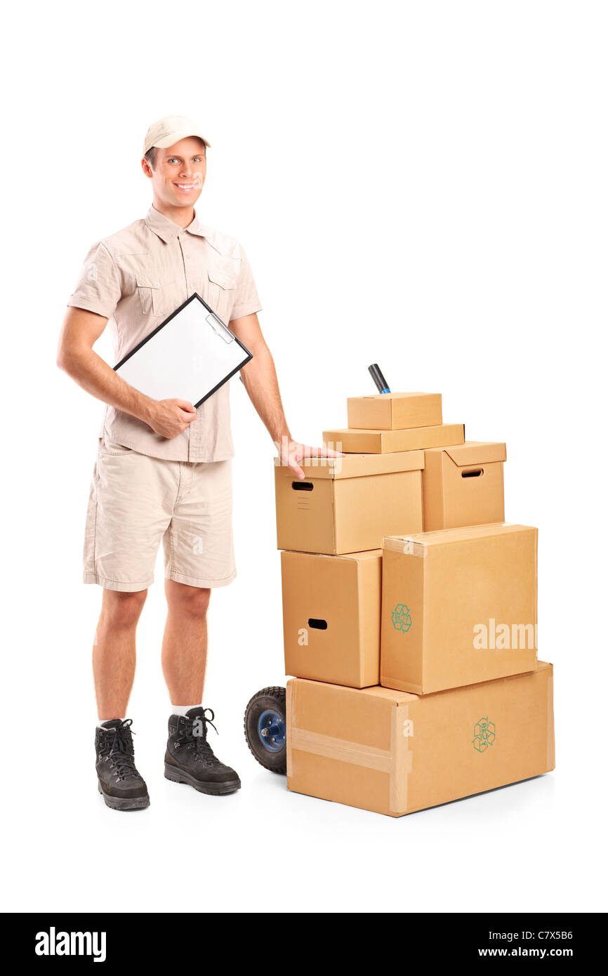 Full length portrait of a delivery person holding a clipboard and hand truck Stock Photo
