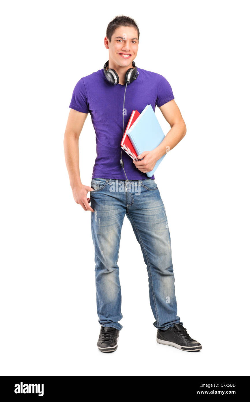Full length portrait of a smiling school boy with headphones holding ...