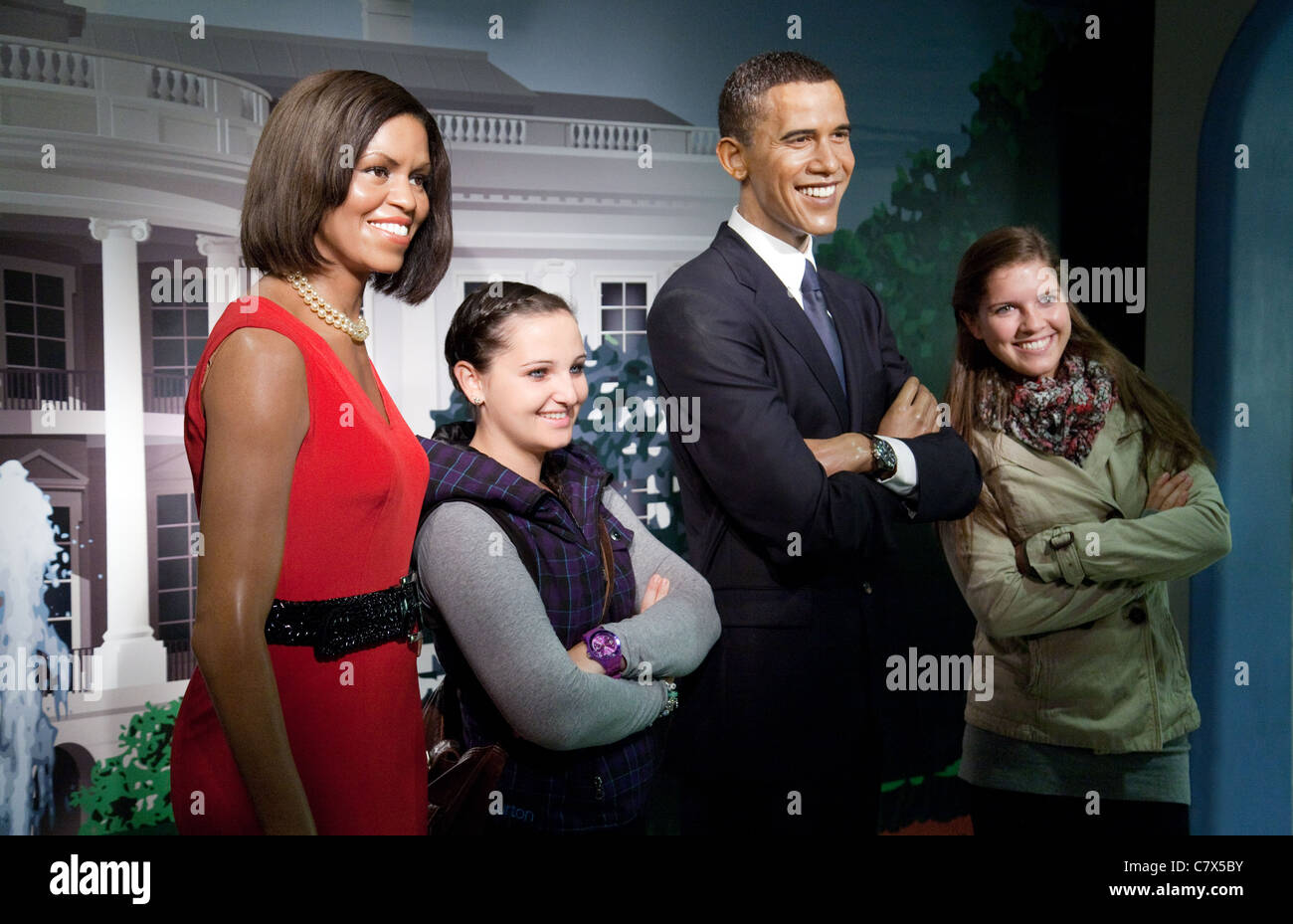 Tourists posing with Barack and Michelle Obama waxworks at Madame Tussauds , Washington DC USA Stock Photo