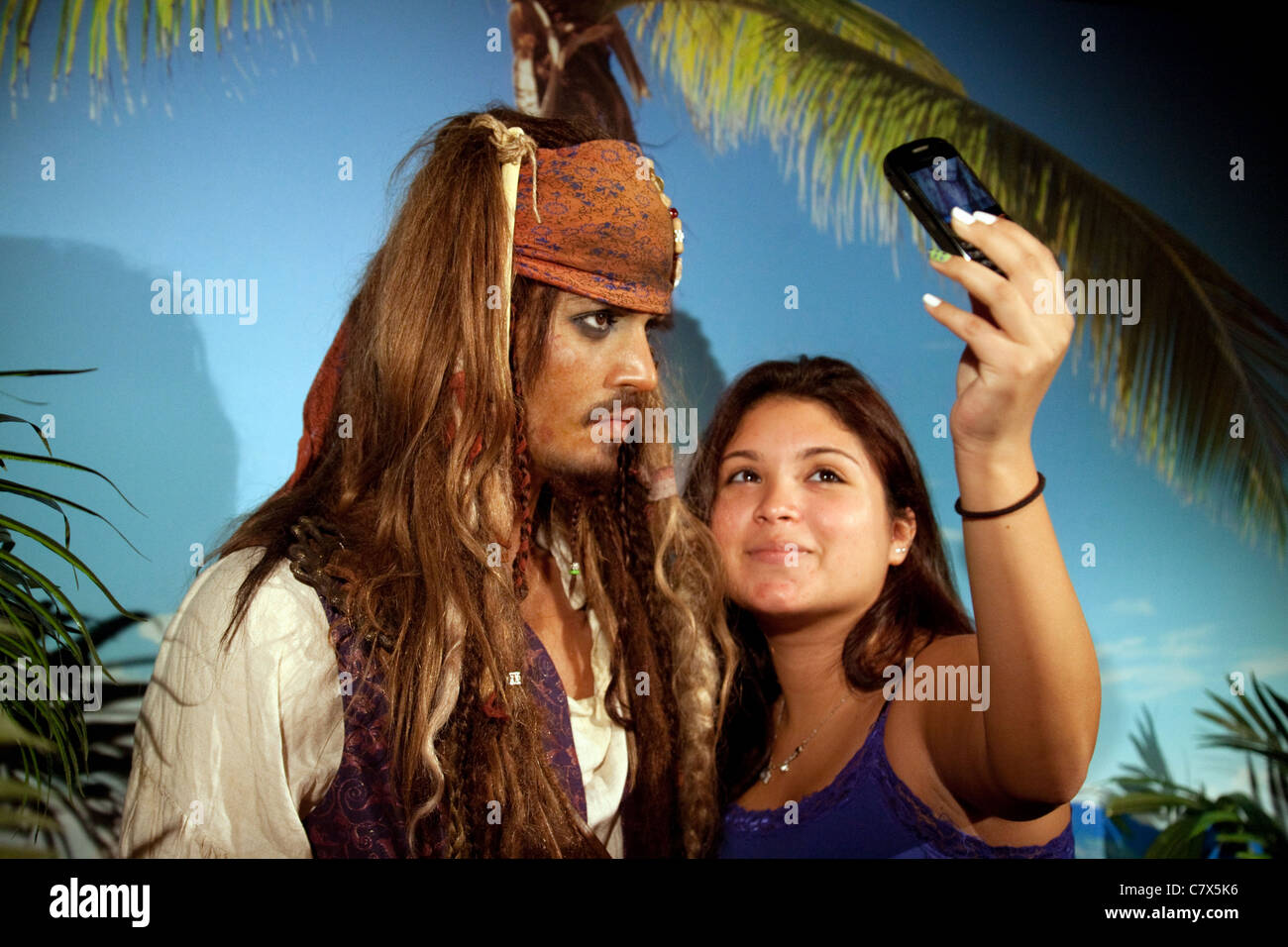 Woman taking a selfie, with waxwork of Johnny Depp, Captain Jack Sparrow, Madame Tussauds waxworks, Washington DC, USA Stock Photo