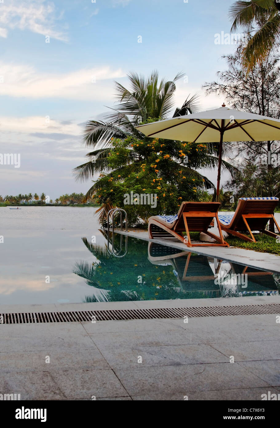 early morning fisherman, deck chairs, eternity poolside Green Lagoon ...