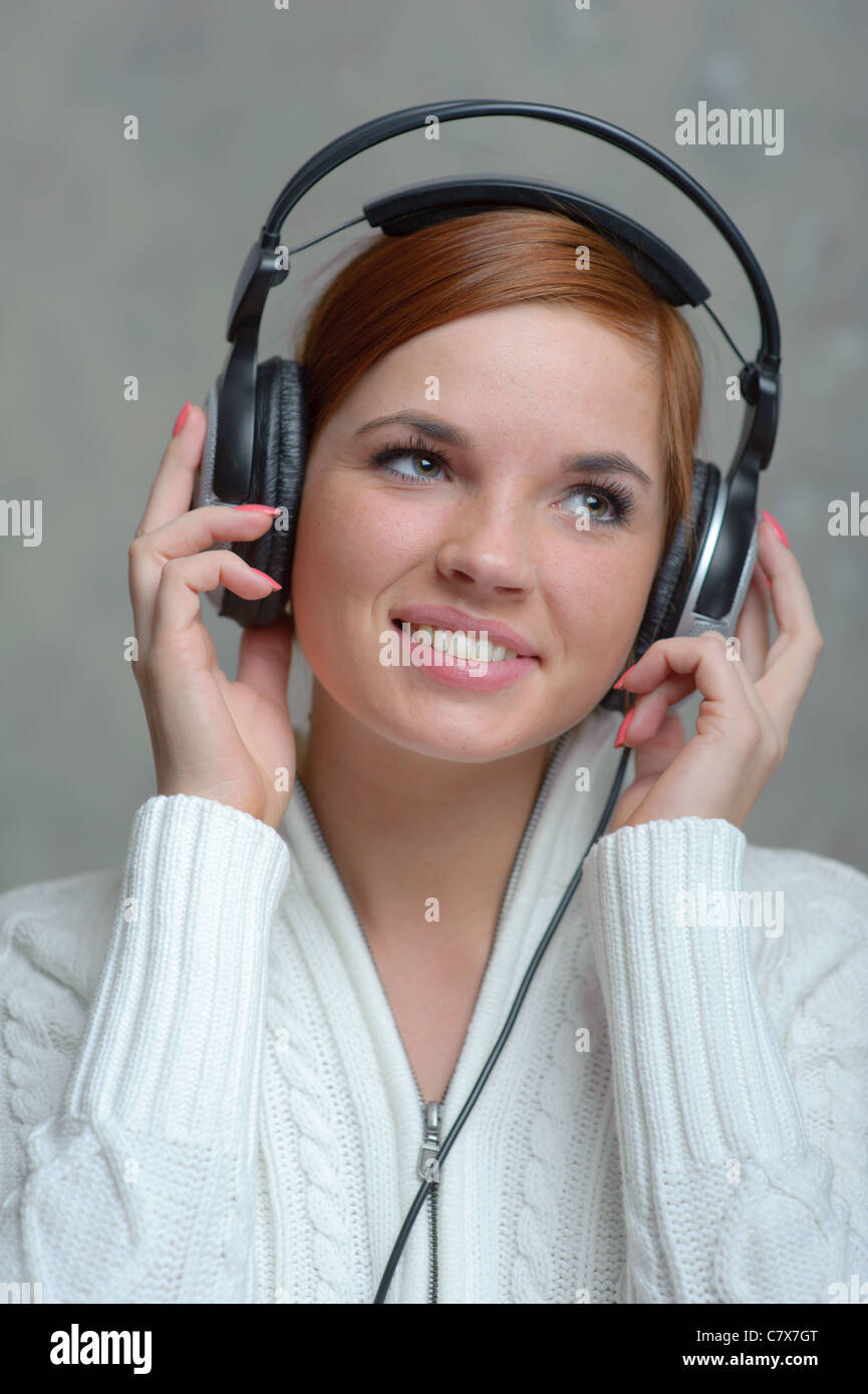 Portrait of beautiful girl listening headphones Stock Photo