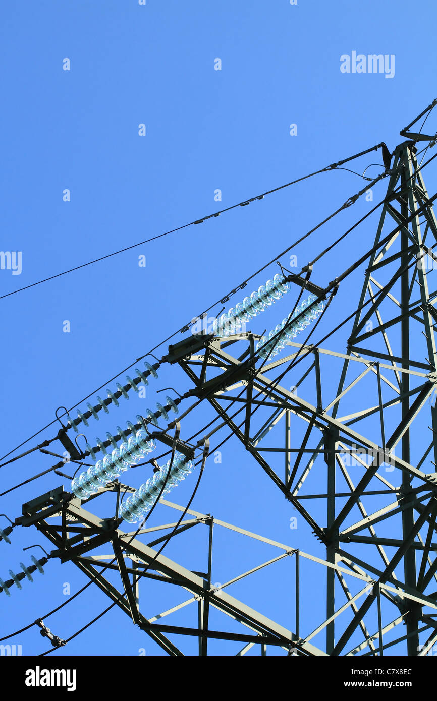 Detail of electricity pylon against blue sky Stock Photo - Alamy
