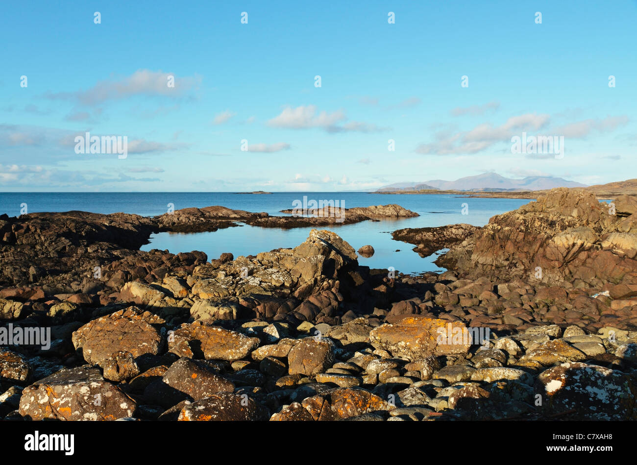 Sanna Bay,Typical view from on the Portuaik to Sanna Coastal Walk, towards Senna with Isle of Rum in distance, Ardnamurchan, Scotland, UK Stock Photo