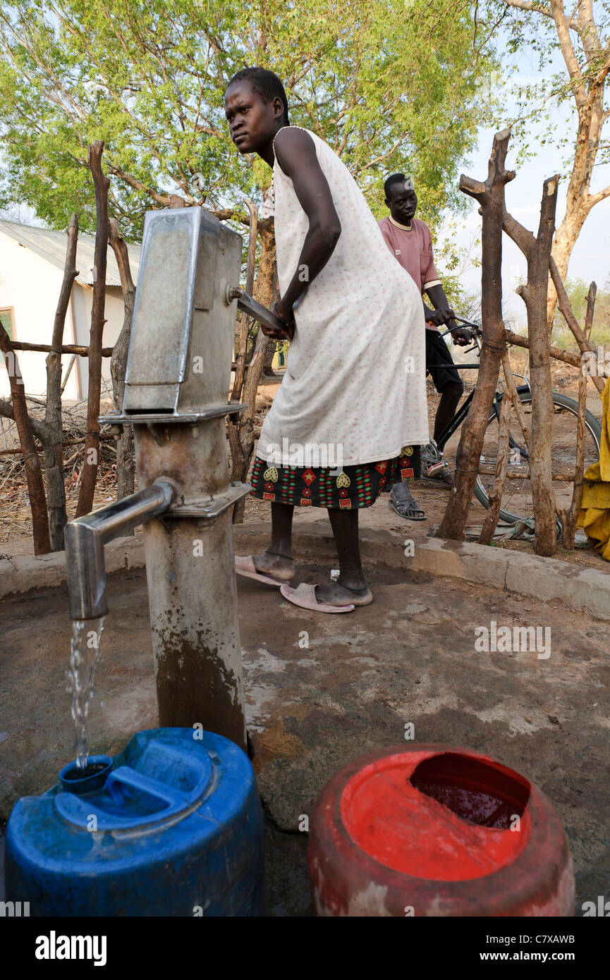 A woman pumping water from a borehole, Luonyaker, Bahr el Ghazal, South Sudan. Stock Photo