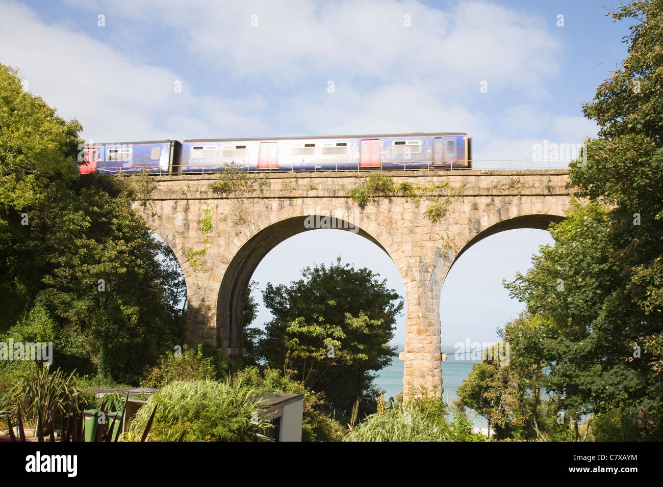 The St Ives train crossing the bridge at Carbis Bay, Cornwall, England, UK Stock Photo