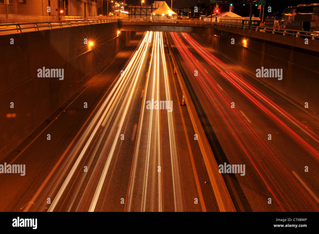 Traffic at night with traces of lights left by the cars on a highway