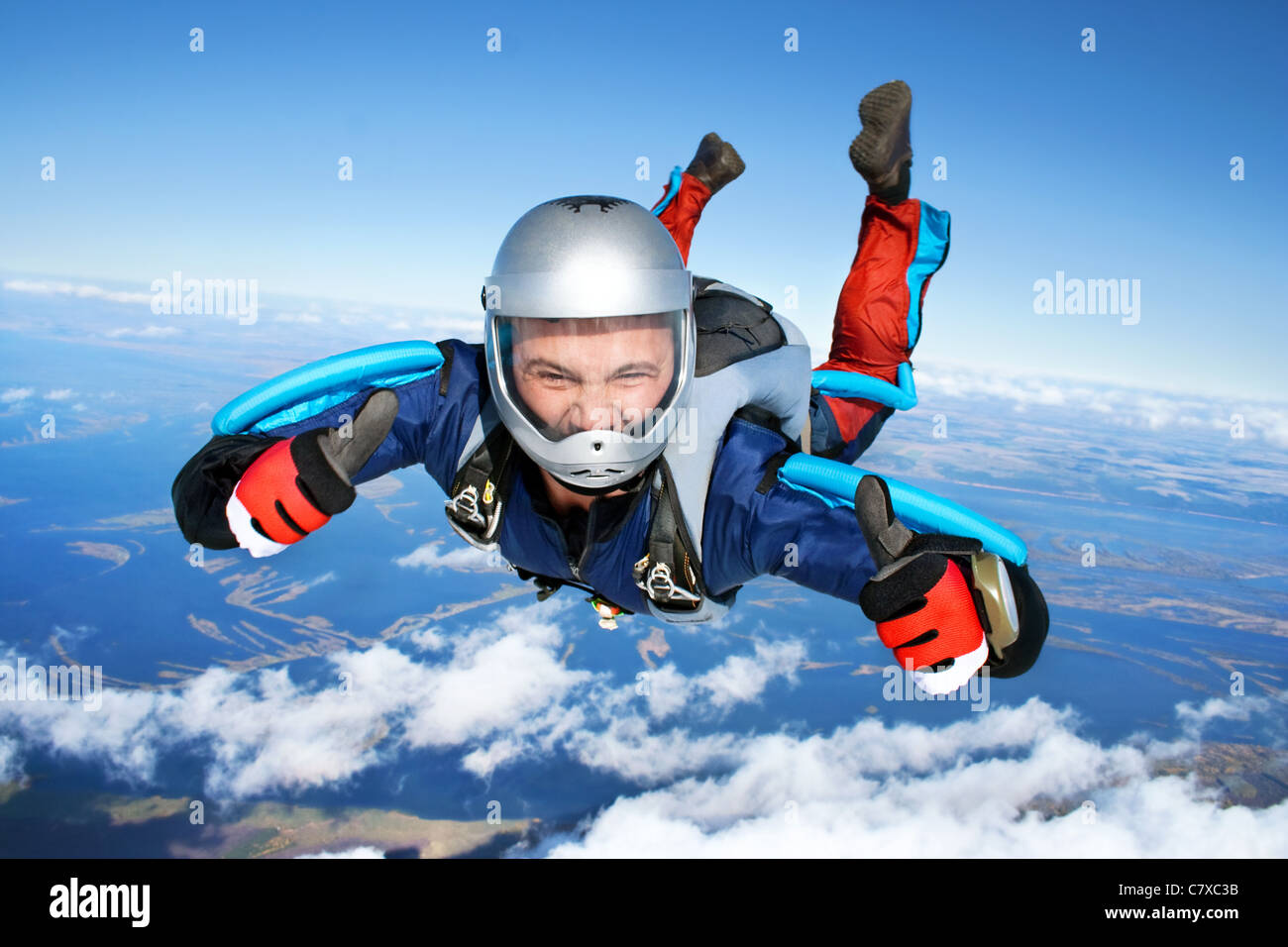 Skydiver falls through the air. Stock Photo