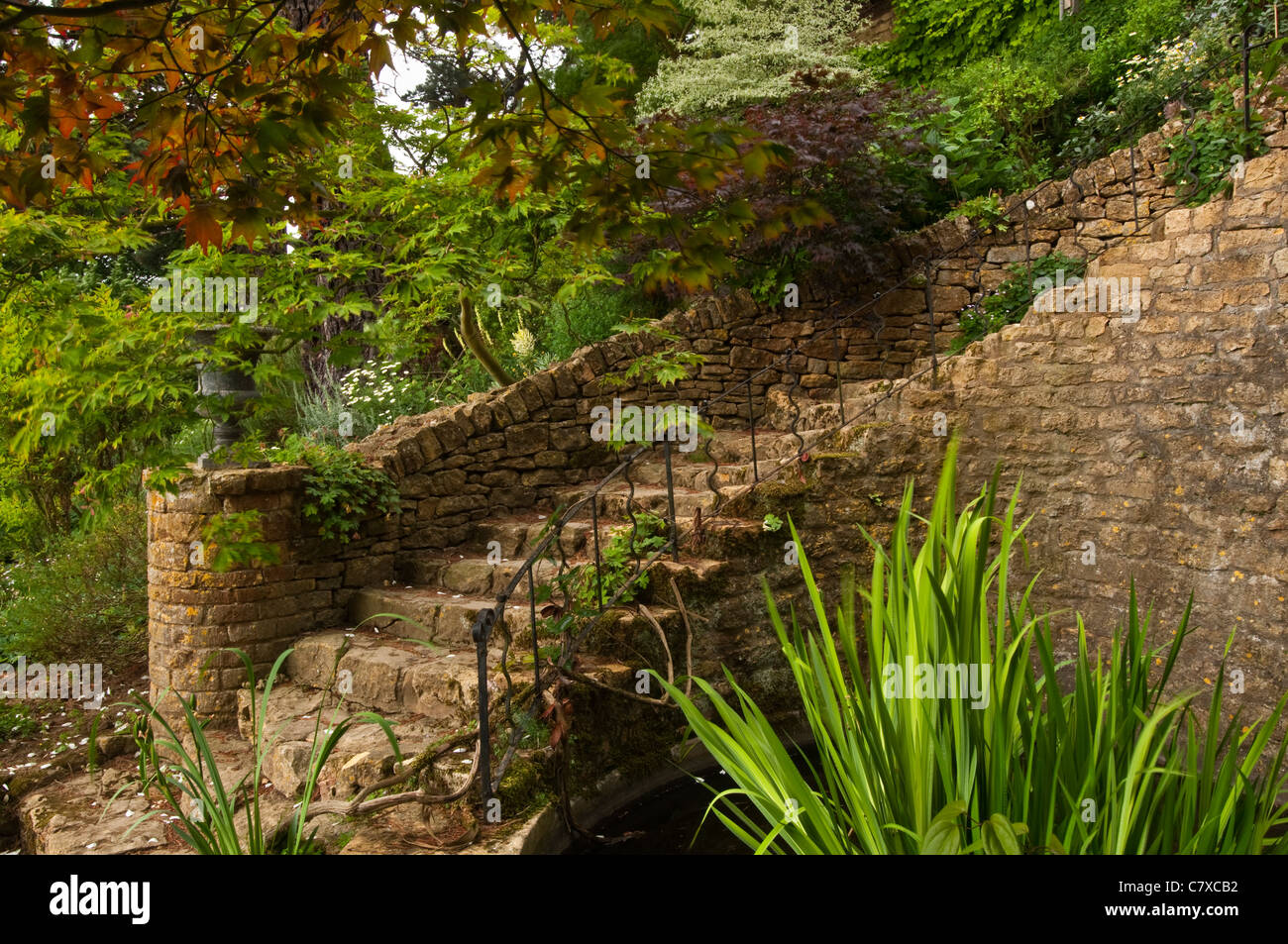 Sweeping stone steps amongst the landscaped gardens of Kiftsgate Court, Chipping Campden, Cotswolds, Gloucestershire, England Stock Photo