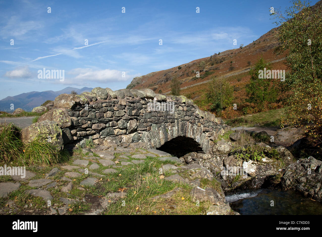 Ashness Bridge traditional stonebuilt packhorse bridge and High Fells