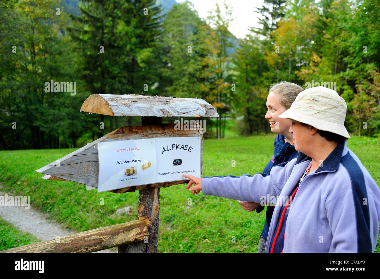 Swiss sign: reads 'Alpkäse – selbstbedienung im Kühlschrank' = 'Alp cheese - self service in fridge' Linked with image C7XDYB Stock Photo