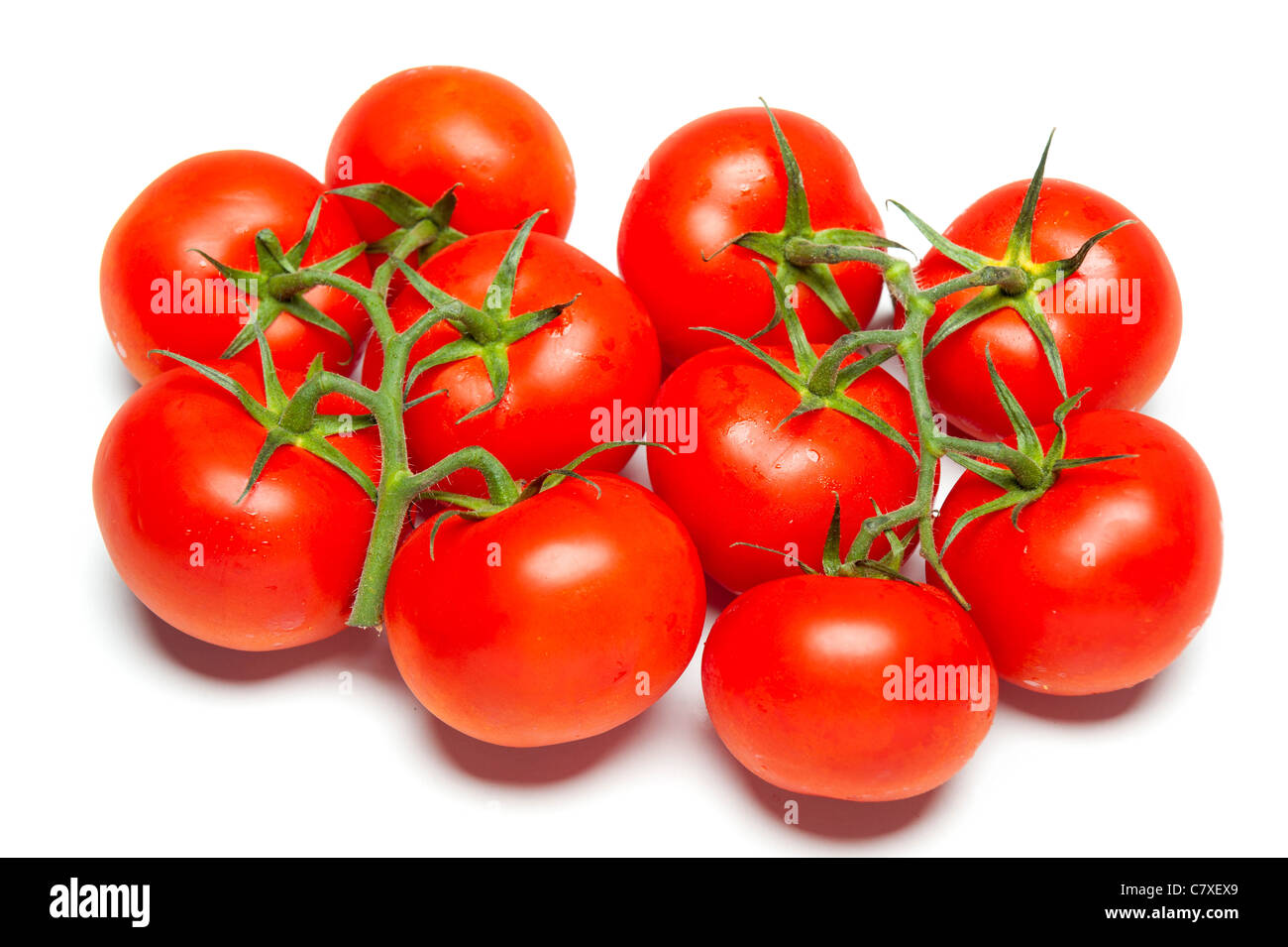 Ripe red tomatoes on isolated white studio background Stock Photo - Alamy