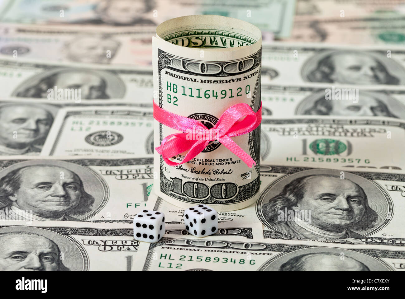 Two dices on money background - business concept Stock Photo