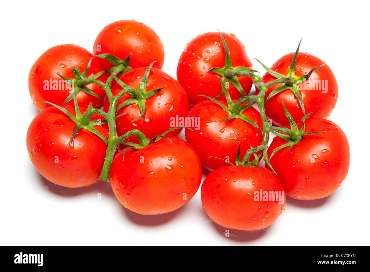 Ripe red tomatoes on isolated white studio background Stock Photo - Alamy