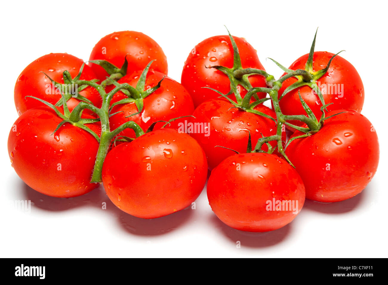 Ripe red tomatoes on isolated white studio background Stock Photo - Alamy