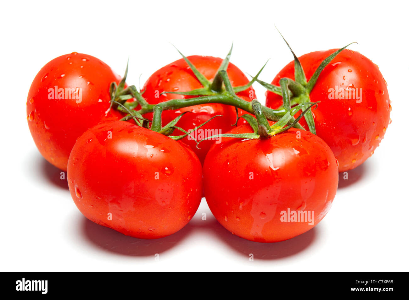 Ripe red tomatoes on isolated white studio background Stock Photo - Alamy