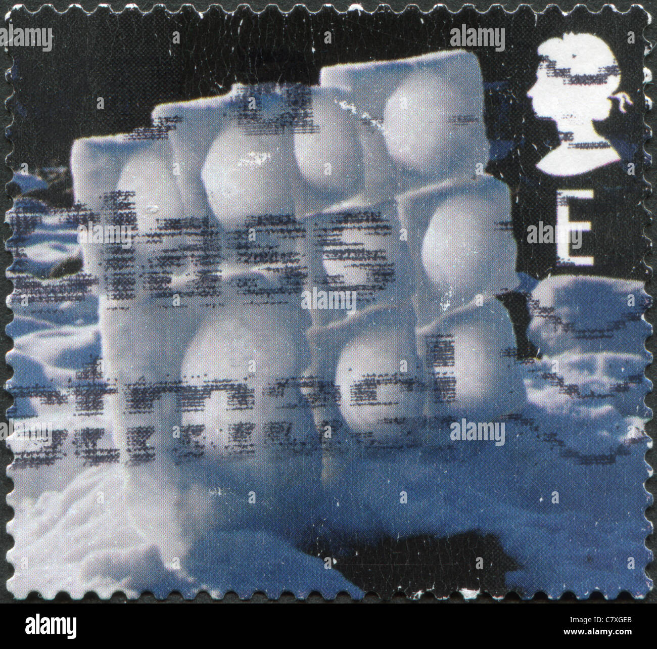 UK - 2003: A stamp printed in England, depicts shows the Ice and snow sculptures by Andy Goldsworthy, Wall of Frozen Snow Stock Photo