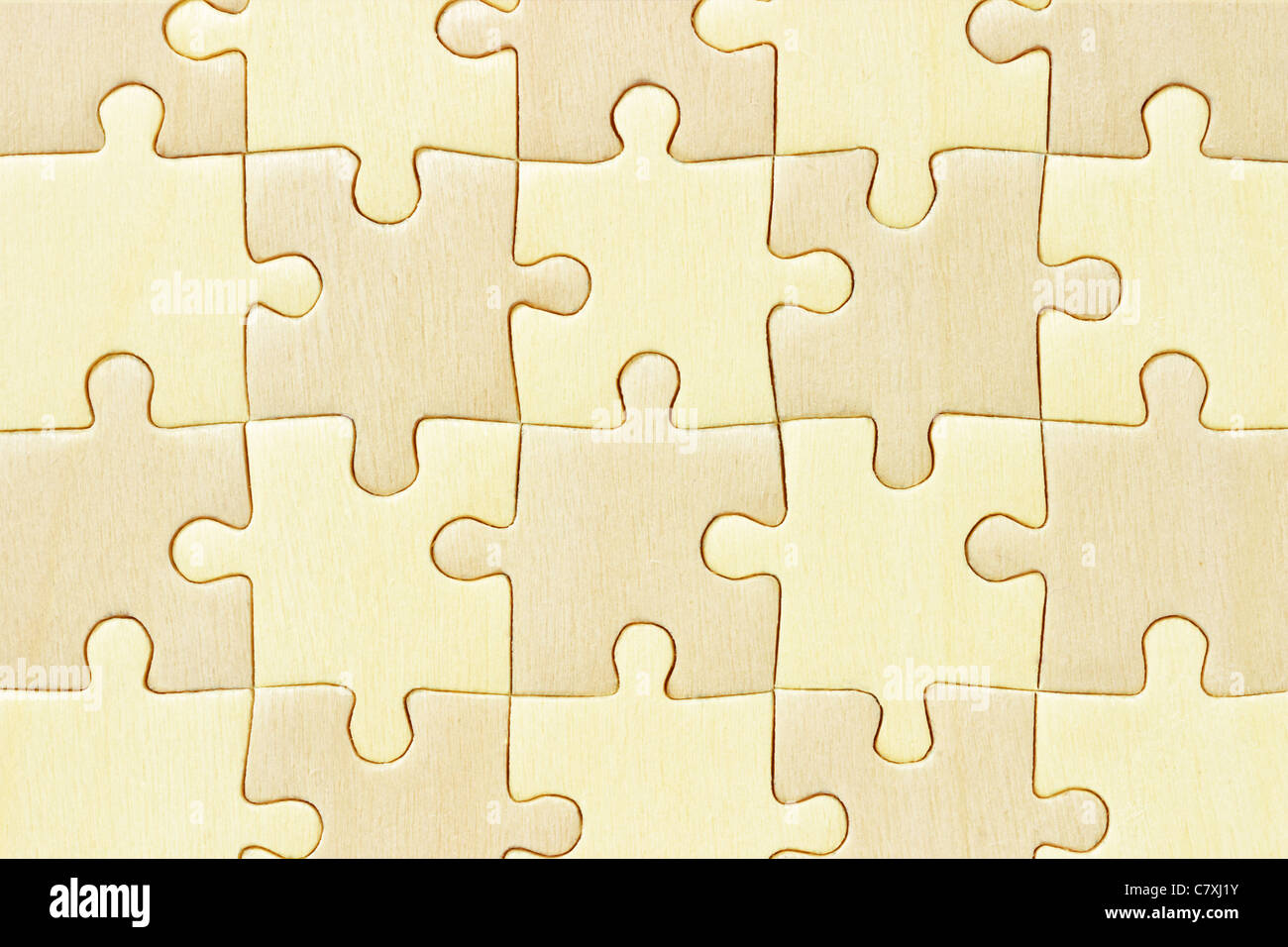 Close up image of checkered wooden jigsaw puzzle background Stock Photo