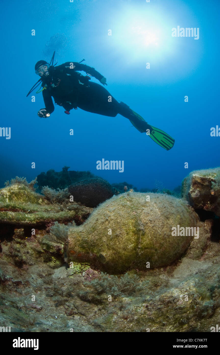 Scuba Diver discovers Amphora, Fethiye, Dalaman, Mediterranean Sea, Turkey Stock Photo