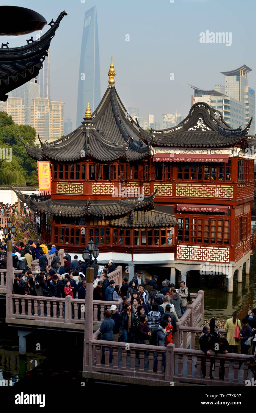 The zig zag bridge is an important feature of the Yuyuan Gardens. The Shanghai World Financial Centre (SWFC) is visible behind. Stock Photo