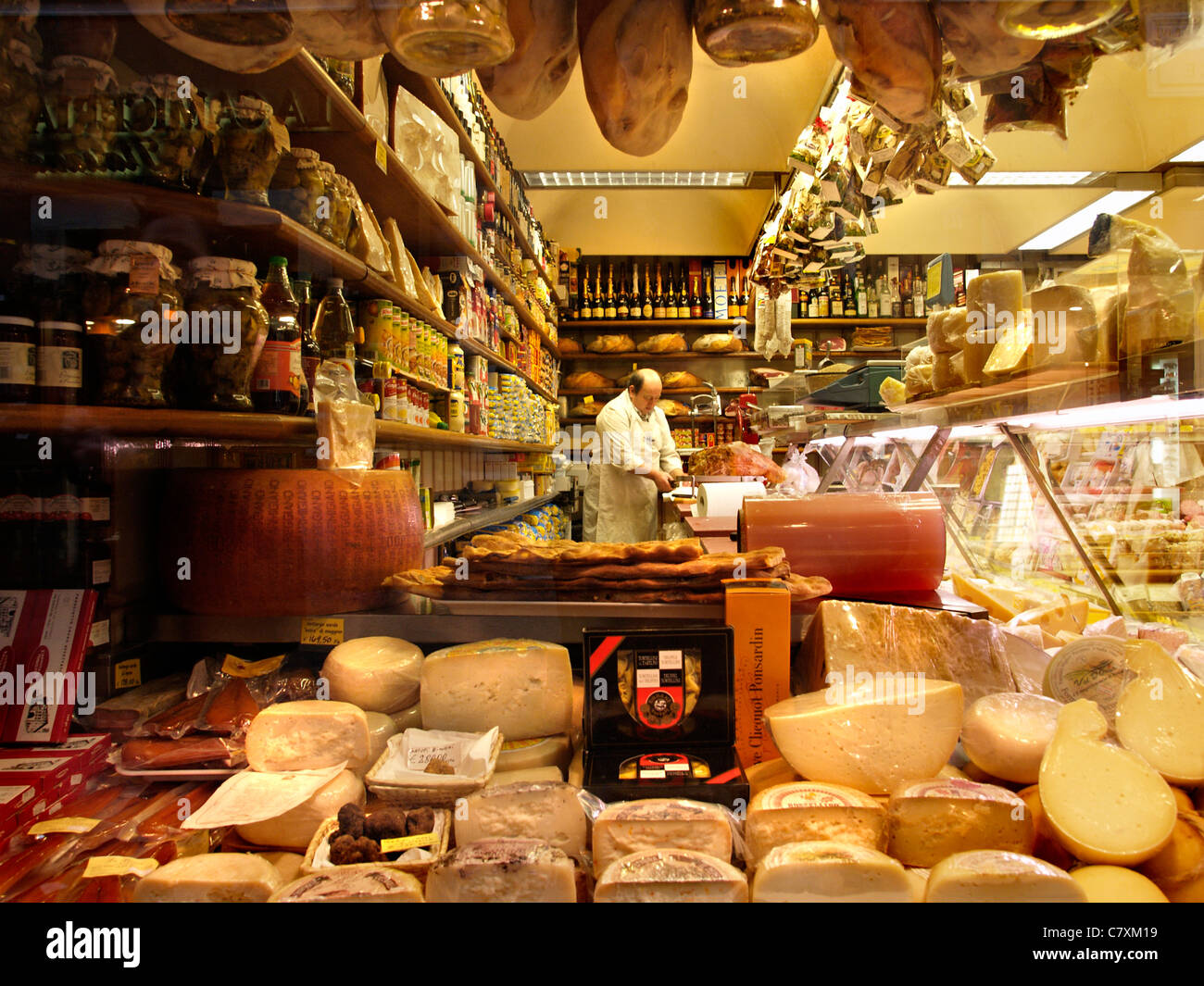 Delicatessen food store with cheese, ham, wine, in the Via dei Condotti shopping district in Rome, Lazio, Italy Stock Photo