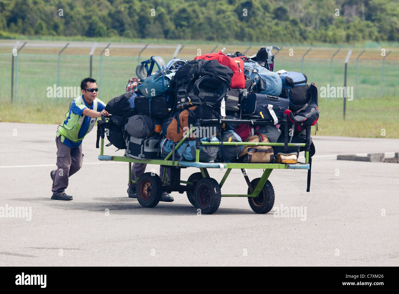 Luggage being moved on a trolley at Mulu airport, Sarawak, Malaysian Borneo Stock Photo
