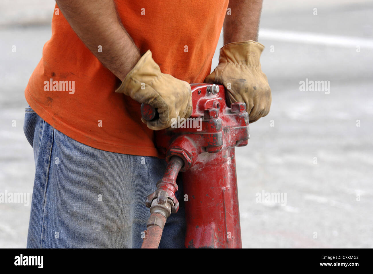 Close up of a compressed air jack hammer being use by a male worker Stock Photo Alamy