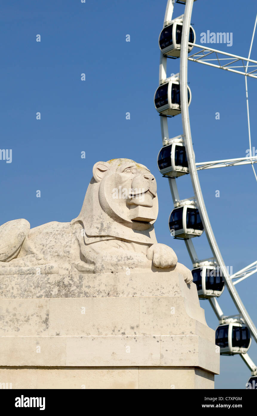 Lion statue part of WW2 War memorial with Plymouth Eye in background Devon UK Stock Photo