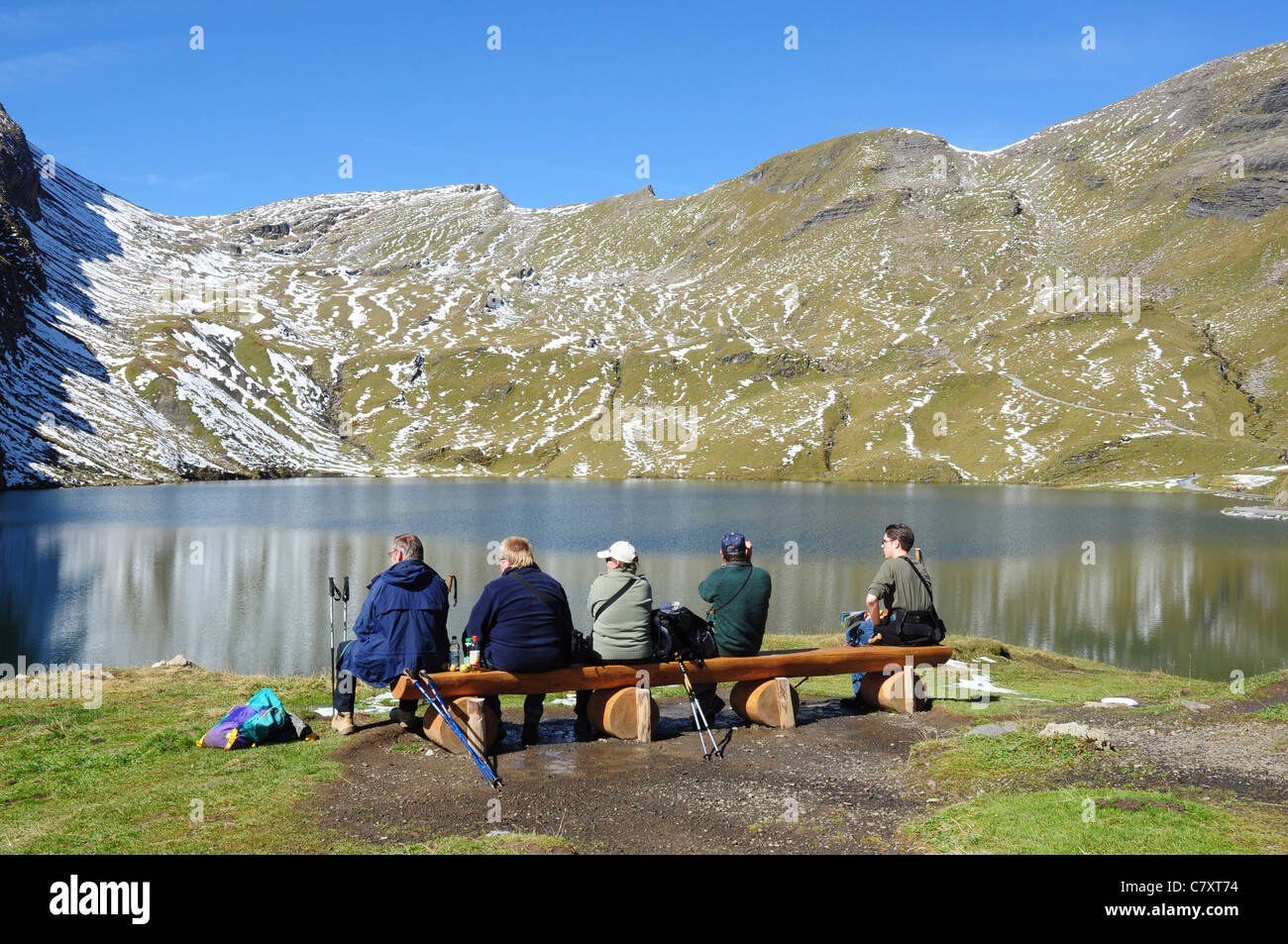 Bachalpsee mountain lake and walkers enjoying the view Stock Photo