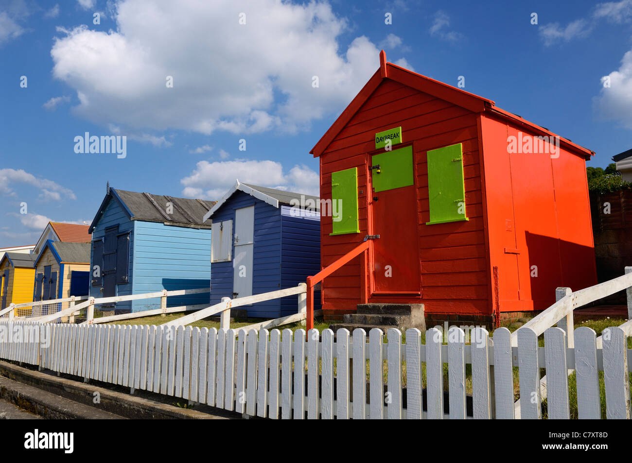 Beach huts along the seafront of the seaside resort of Westward Ho!, Devon, England. Stock Photo