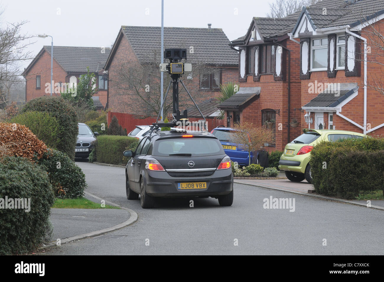 A Google car drives down a residential cul de sac in Manchester. Photographing and mapping the street for google street view. Stock Photo