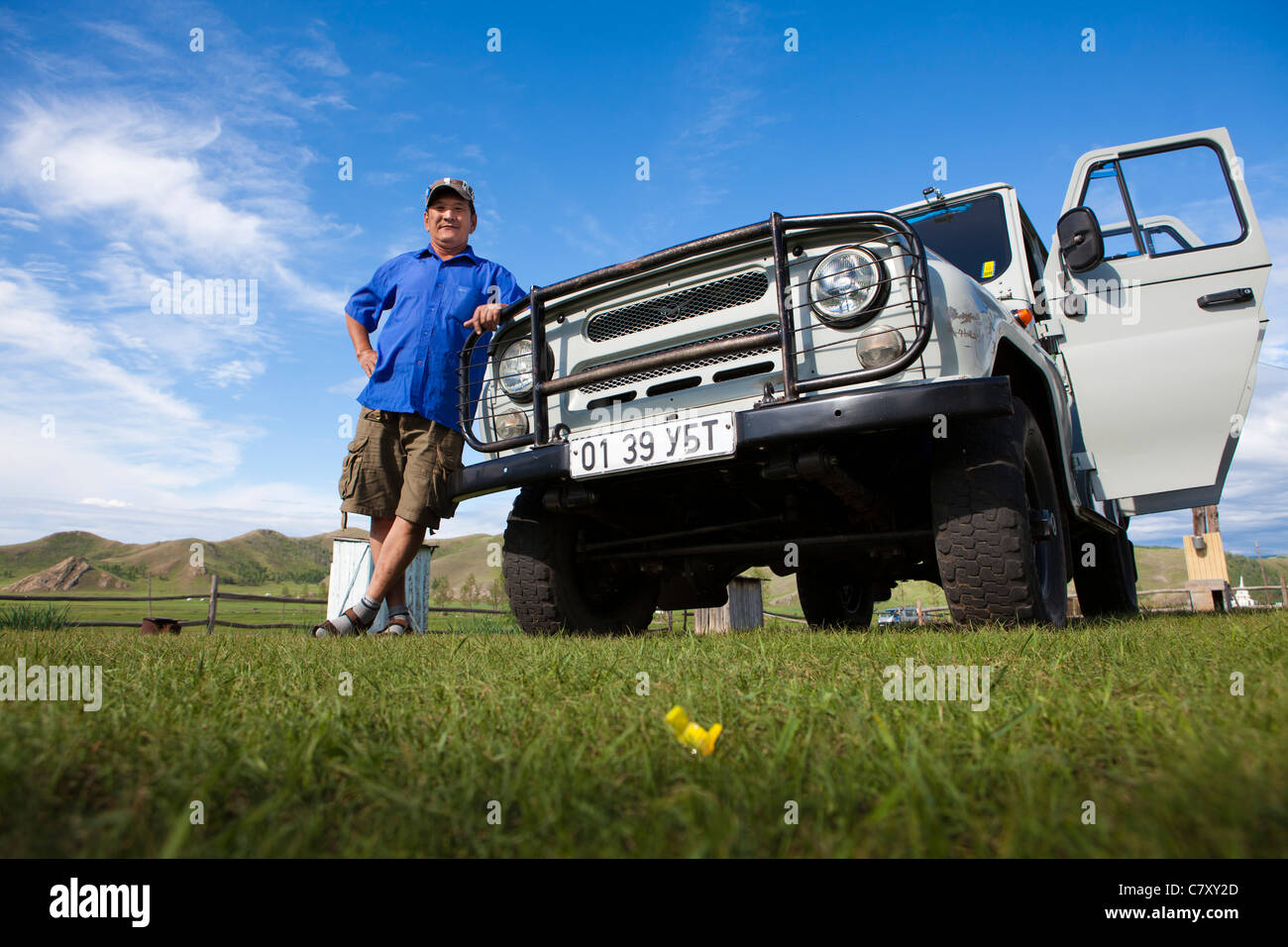 Russian jeep UAZ-469 with owner in Mongolia on steppe, Mongolia. Stock Photo