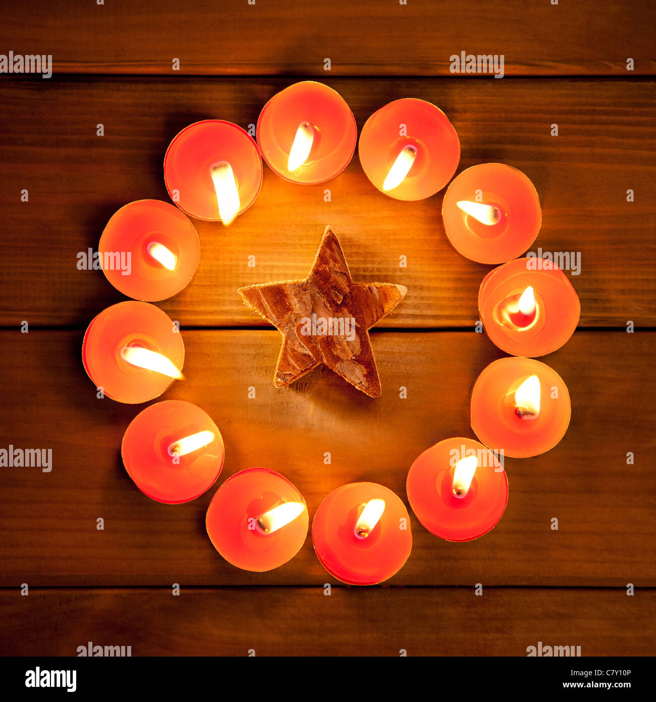 christmas candles circle over wood and bark star symbol Stock Photo
