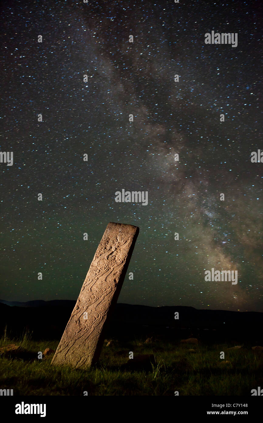 Age of Bronze Deer stone with milky way in Moron, Mongolia. Stock Photo
